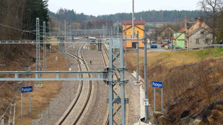 V roce 2021, nově byly zbudovány nástupiště, podchod a opravena budova nádraží - Zde, v místech dnešního Pačejova nádraží, byla zřízena železniční stanice Olšany (dnes Pačejov). Tato stanice je nejvýše položenou na trase České Budějovice – Plzeň. Nadmořská výška zde činí 535 metrů nad mořem. Pro dokreslení: rozdíl mezi stanicemi Pačejov a Horaž-ďovice – předměstí (432 m.n.m.) je 103 metry, což znamená, že mezi 12 kilometrů vzdálenými místy stoupá trať průměrně každých 100 metrů o 86 centimetrů. 1. dubna 1867 bylo pod vsí započato s výstavbou železniční trati a 20. září toho roku začali železniční dělníci pokládat koleje.
27. července 1868 do železniční stanice Olšany přijela v rámci zkoušky trati první lokomotiva a 18. srpna první slavnostní vlak. Provoz trati byl zahájen 1. září. V té době byly postaveny nádražní budovy s poštovní a telegrafní stanicí a přilehlé sklady. Později přibyly oba hostince a dům pro zaměstnance dráhy, tzv. "parlament".